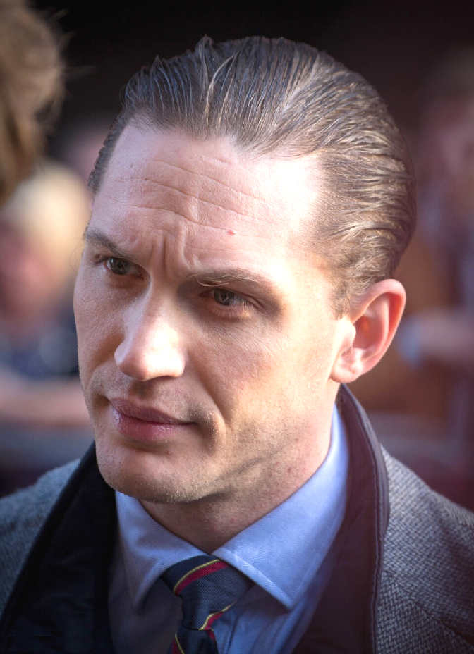 Edward Thomas Hardy (born 15 September 1977) is an English actor. Known for his intense screen presence and versatility, he has established a career across independent films, major studio productions, and television, often portraying complex and psychologically driven characters. After training at the Drama Centre London, Hardy made his film debut in Black Hawk Down (2001). He gained early recognition for his roles in Star Trek: Nemesis (2002) and RocknRolla (2008), before achieving critical acclaim for Bronson (2008), Warrior (2011), Tinker Tailor Soldier Spy (2011), Lawless (2012), and Locke (2013).