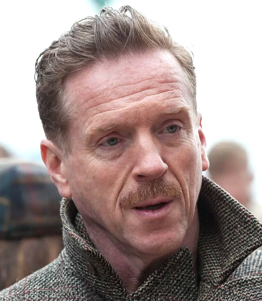 Damian Watcyn Lewis (born 11 February 1971) is a British actor and musician. He rose to prominence portraying U.S. Army Major Richard Winters in the HBO miniseries Band of Brothers. Lewis won a Primetime Emmy Award and a Golden Globe Award for his portrayal of U.S. Marine Sergeant Nicholas Brody in the Showtime series Homeland, and received nominations for his performance as Henry VIII of England in Wolf Hall. He portrayed Bobby Axelrod in the Showtime series Billions in six out of seven seasons, and appeared in Once Upon a Time in Hollywood (2019) as actor Steve McQueen.